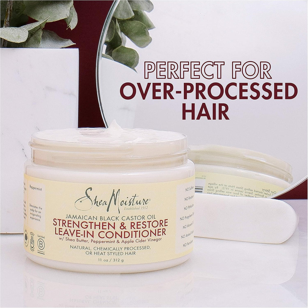 Shea Moisture Jamaican Black Castor Oil Strengthen & Restore Leave-In Conditioner, 11.5 oz jar. Close-up of Shea Moisture leave-in conditioner with shea butter, peppermint, and apple cider vinegar.